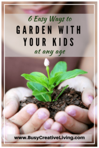 Child holding seedling. Gardening with Kids
