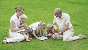Family playing board games. Staycation ideas for families