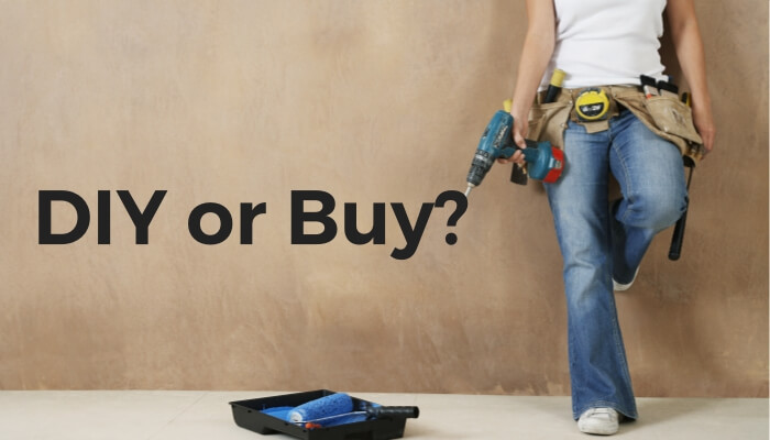Woman with tools. DIY or Buy